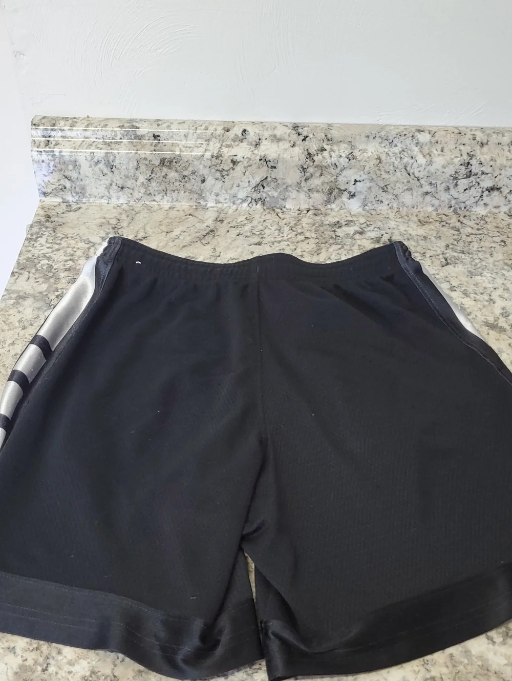 NIKE KIDS Black Athletic Shorts with White Swoosh